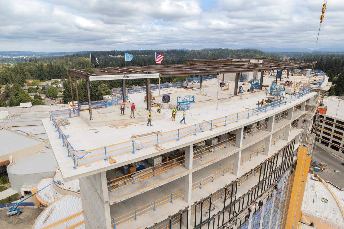 The final beam for Muckleshoot Casino’s resort tower is moved into place atop the 18-story structure on Friday, Aug. 26, 2022.