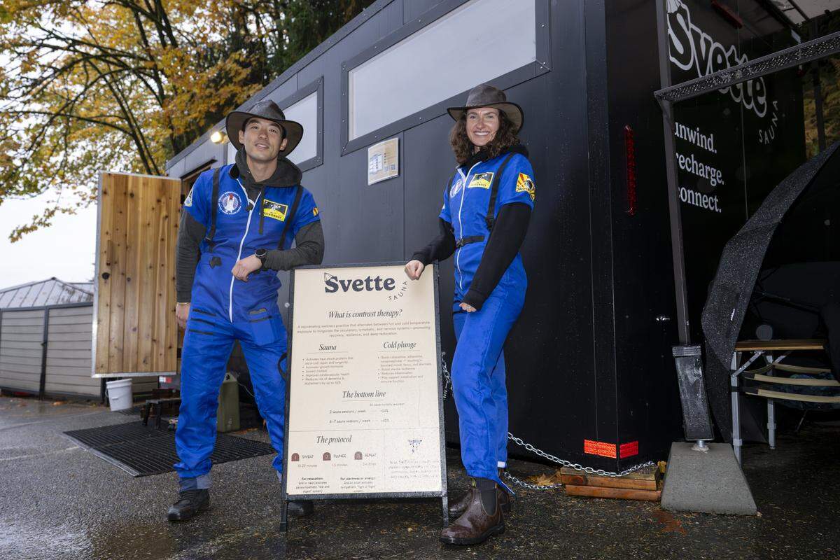 Svette Sauna owners Leon Sung, left, and Hayley Bostrom stand outside of the sauna on Friday, Oct. 31, 2025, located in the parking lot of Owen Beach at Point Defiance Park in Tacoma.