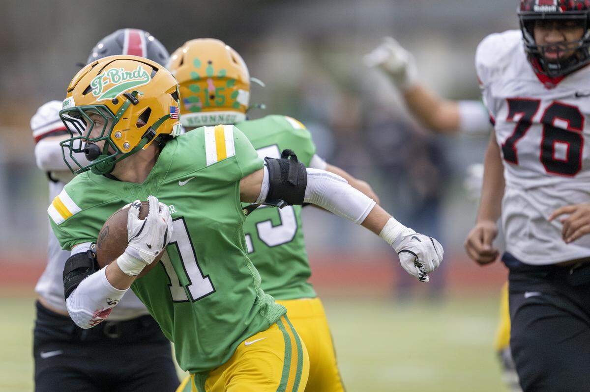 Tumwater running back Grady Wall (11) carries the ball during a game against Franklin Pierce on Saturday, Nov. 22, 2025, in Tumwater, Wash.