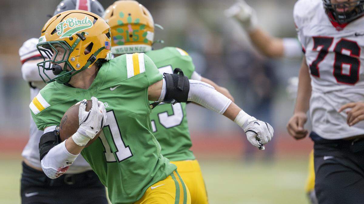 Tumwater running back Grady Wall (11) carries the ball during a game against Franklin Pierce on Saturday, Nov. 22, 2025, in Tumwater, Wash.