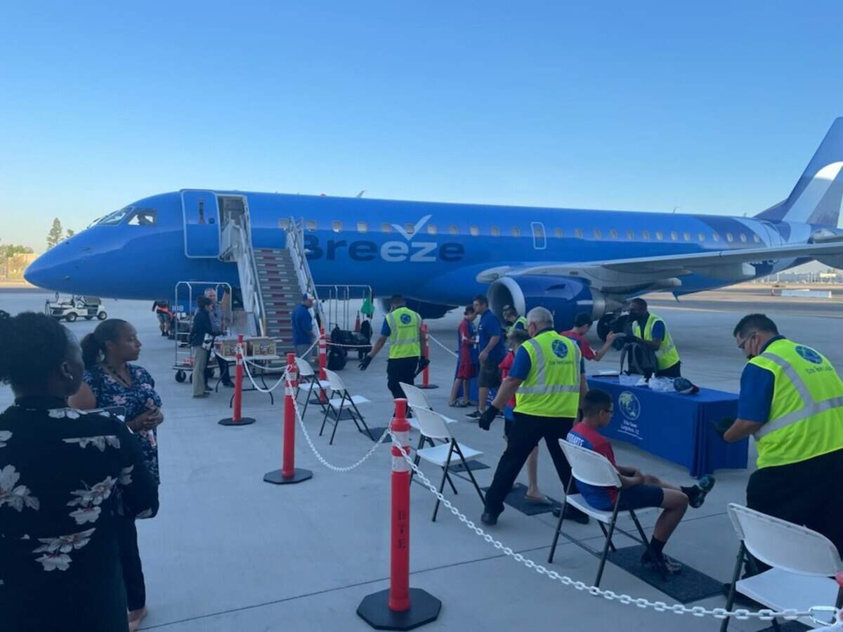 The Bonney Lake-Sumner Little League team goes through security as they board a plane to Williamsport, PA Saturday morning. Honolulu Little League, the team BLS will play on Wednesday, was also on the plane.