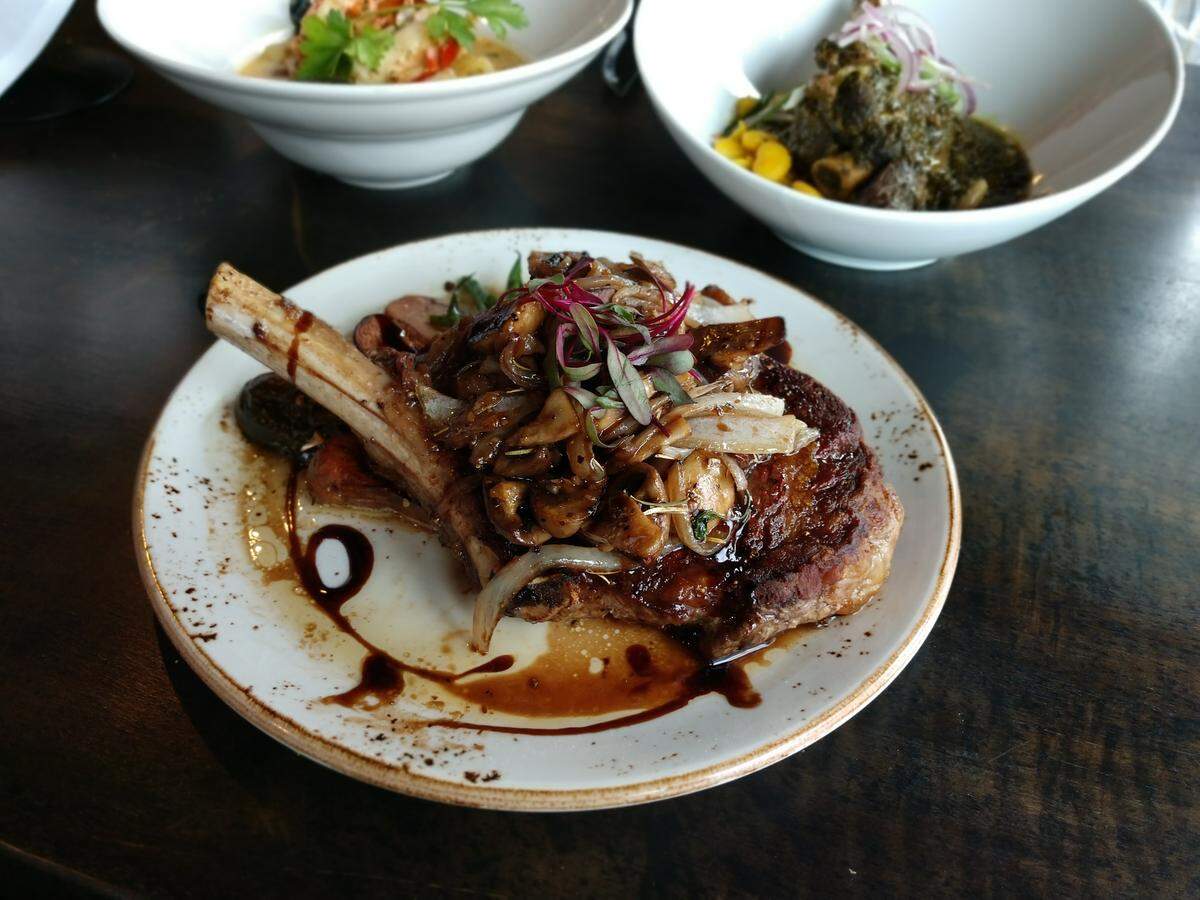 A bone-in ribeye steak from Gino’s at the Point on the Dash Point waterfront.