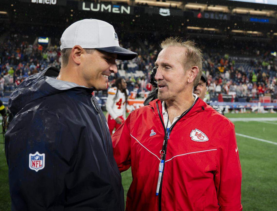 Seattle Seahawks head coach Mike Macdonald and Kansas City Chiefs defensive coordinator Steve Spagnuolo talk after the Seattle Seahawks 33-16 victory in the preseason game at Lumen Field, on Friday, Aug. 15, 2025, in Seattle.