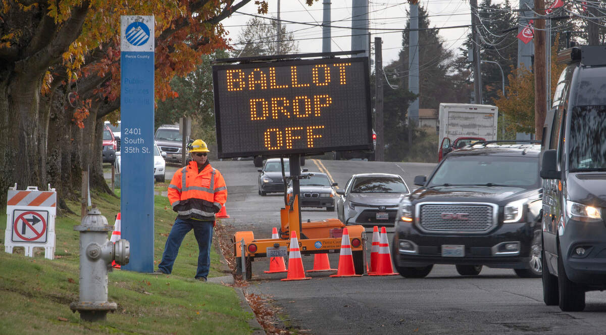 Traffic is directed for drop-off and in-person voting at the Pierce County Annex in Tacoma, Washington, on Tuesday, Nov. 5, 2024.