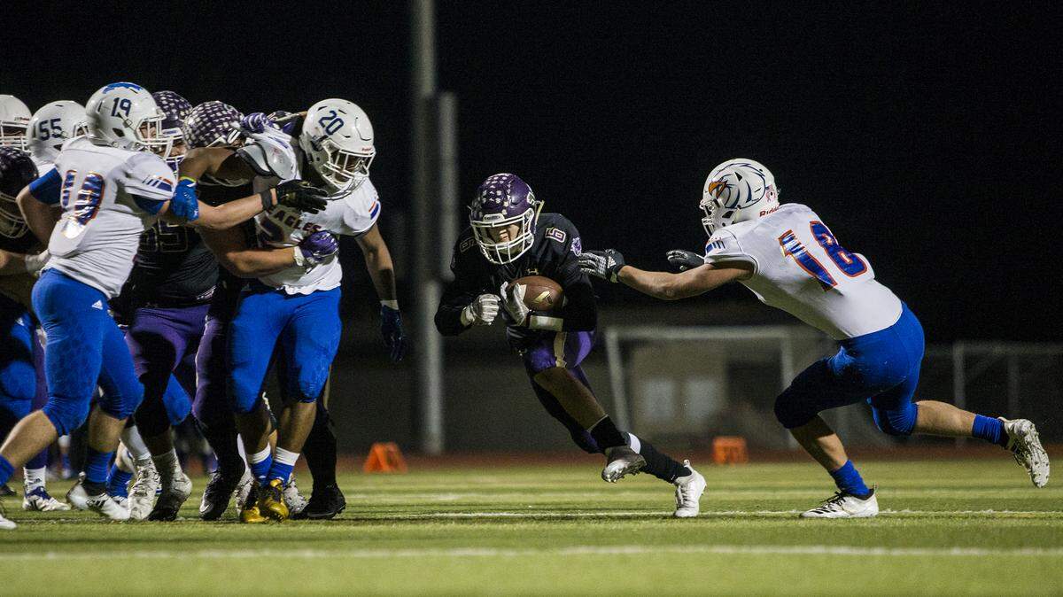 Lake Stevens’ Dallas Landeros runs the ball through a hole in the opposing teams defense in a Class 4A state quarterfinals game against Graham-Kapowsin on Saturday, Nov. 17, 2018 at Lake Stevens High School.