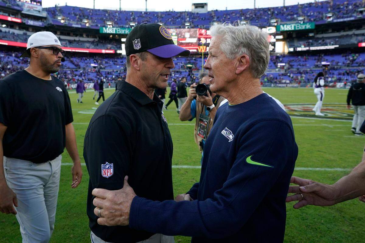 Baltimore Ravens head coach John Harbaugh talks with Seattle Seahawks head coach Pete Carroll, right, after an NFL football game, Sunday, Nov. 5, 2023, in Baltimore. The Ravens won 37-3. (AP Photo/Alex Brandon)