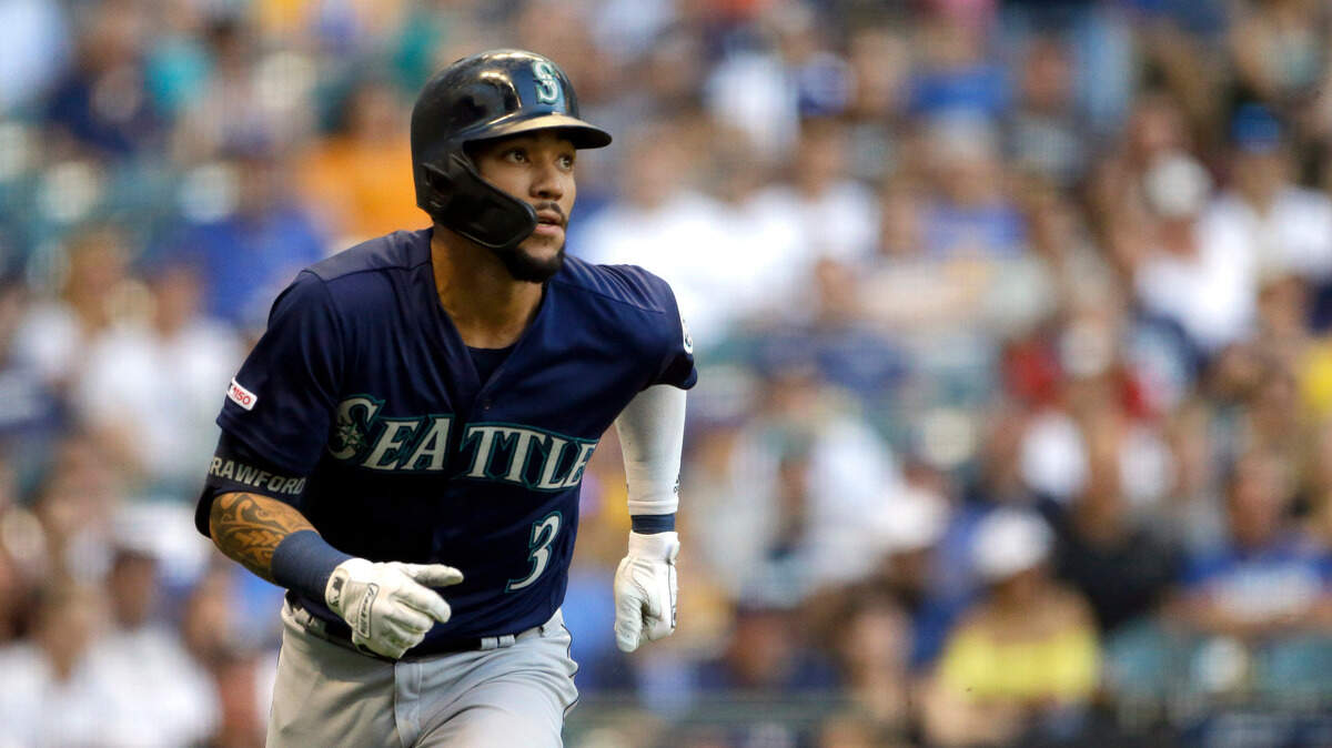 Seattle Mariners’ J.P. Crawford watches his RBI triple during the second inning of the team’s baseball game against the Milwaukee Brewers on Wednesday, June 26, 2019, in Milwaukee.