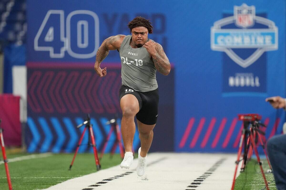 Feb 29, 2024; Indianapolis, IN, USA; Texas defensive lineman Byron Murphy (DL18) works out during the 2024 NFL Combine at Lucas Oil Stadium. Mandatory Credit: Kirby Lee-USA TODAY Sports