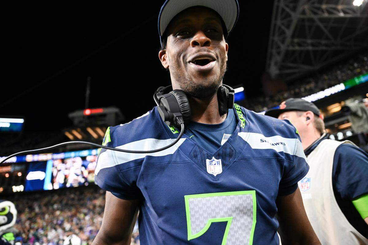 Seattle Seahawks quarterback Geno Smith (7) celebrates a wide receiver Matt Landers (17) touchdown during the fourth quarter of the preseason game against the Minnesota Vikings at Lumen Field, Thursday, Aug. 10, 2023, in Seattle, Wash.