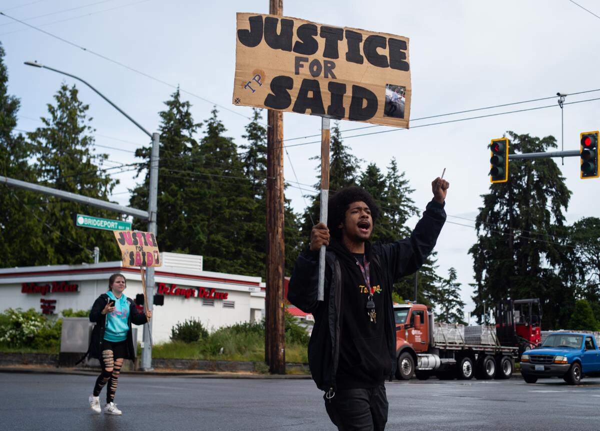 Keanu Forsythe, a friend of Said Joquin, marches with about other 100 people through the streets as part of the Lakewood March of Solidarity in Lakewood on June 6, 2020. Protesters marched in memory of Joquin, who was killed in an officer-involved shooting during a traffic stop on May 1.