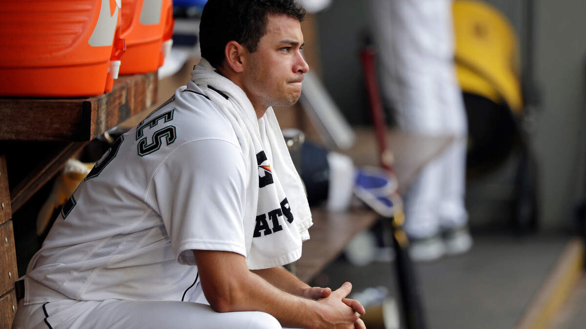 Seattle Mariners starting pitcher Marco Gonzales looks out from the dugout after being relieved against the Houston Astros in the fourth inning of a baseball game Wednesday, Aug. 22, 2018, in Seattle. (AP Photo/Elaine Thompson)