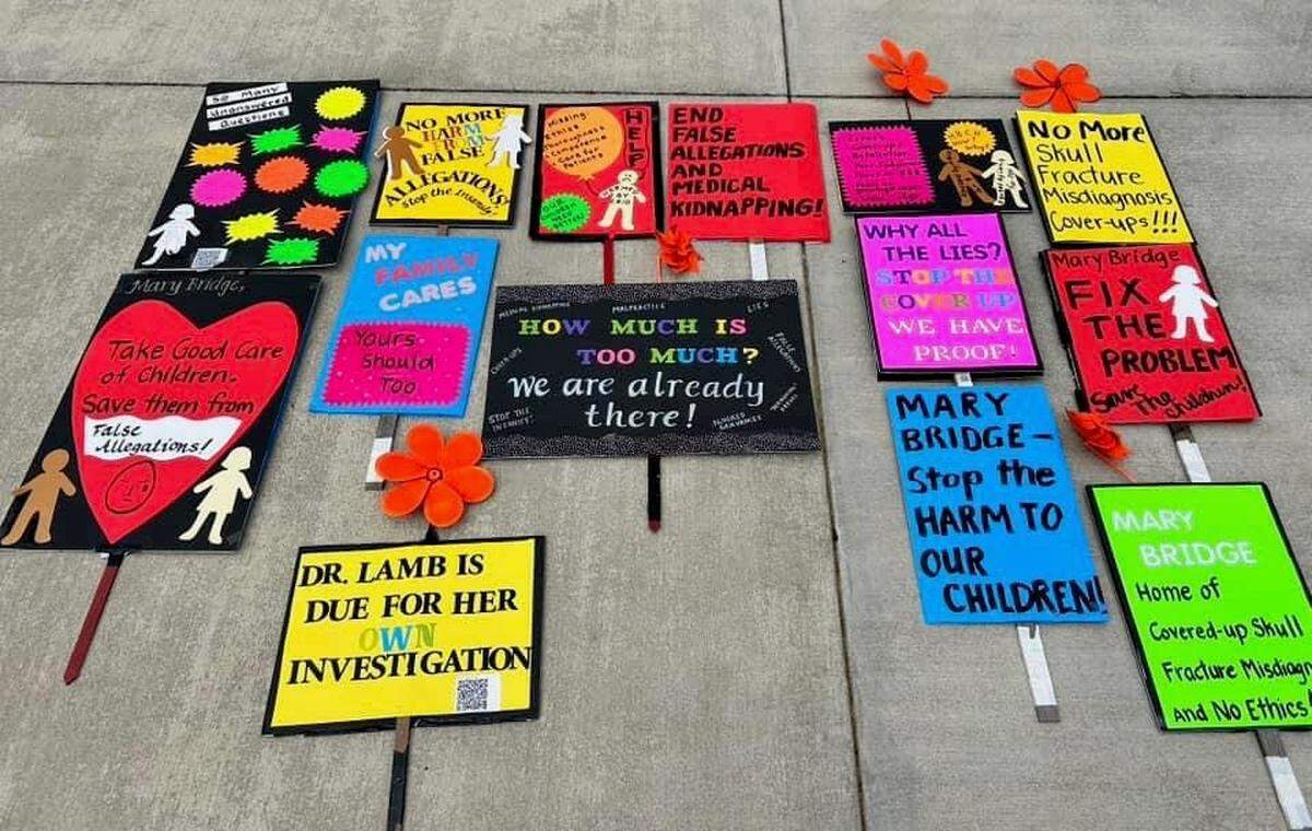 Family and friends of Abraham and Annie Thigpen have held signs and picketed outside Mary Bridge Children’s Hospital a few days each week after the parents were accused of abusing their 5-week-old daughter.