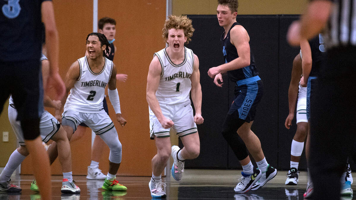 Timberline’s Miles Gurske (2) and Jackson Brown celebrate as time expires in the Blazers come-from-behind 60-57 victory over Gig Harbor during Friday night’s 3A South Sound Conference boys basketball game at Timberline High School in Lacey, Washington, on Jan. 14, 2022.