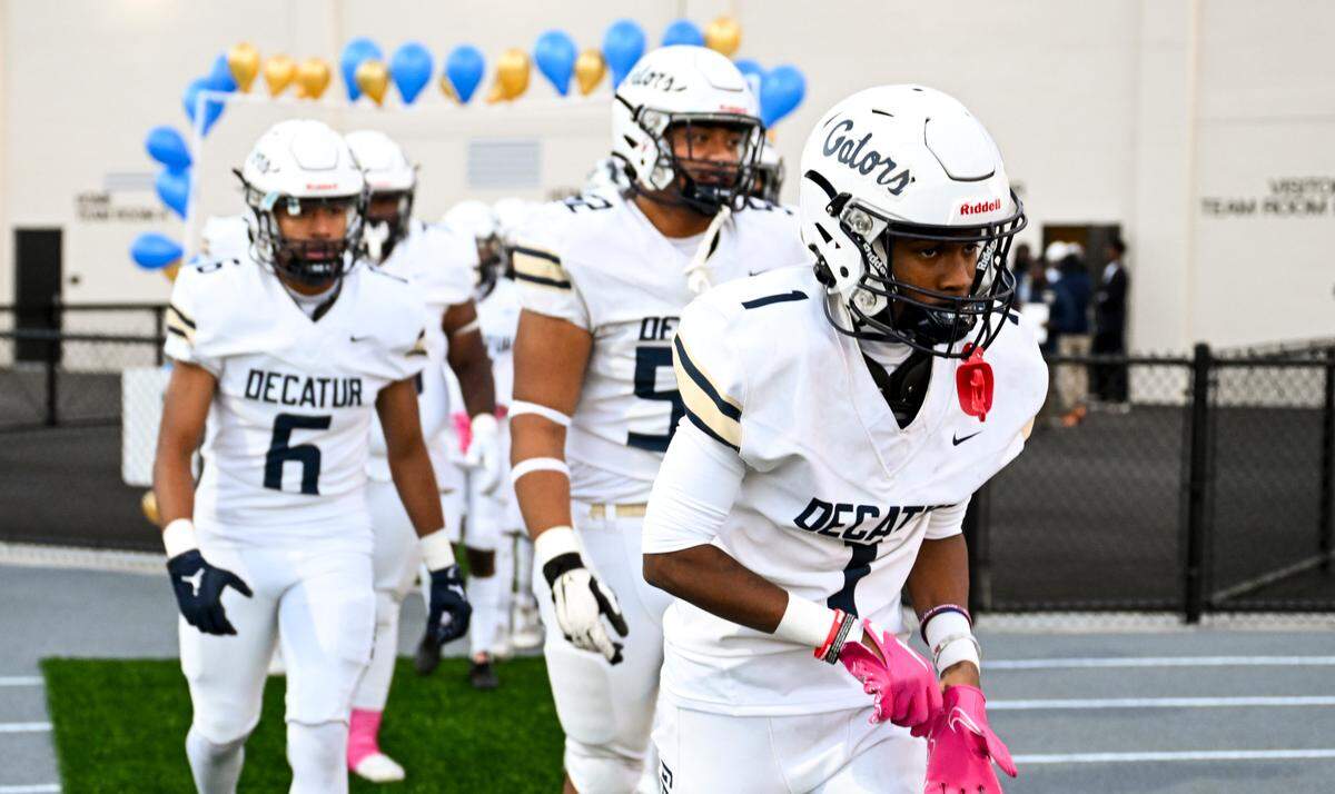 Decatur Golden Gators take to the field before the game against the Federal Way Eagles at Federal Way Memorial Stadium, Thursday, Oct. 26, 2023, in Federal Way, Wash.