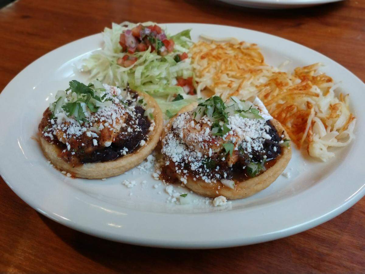 Sopes with black beans, ranchero sauce, cotija cheese and poached eggs from West Pioneer Grill in downtown Puyallup.