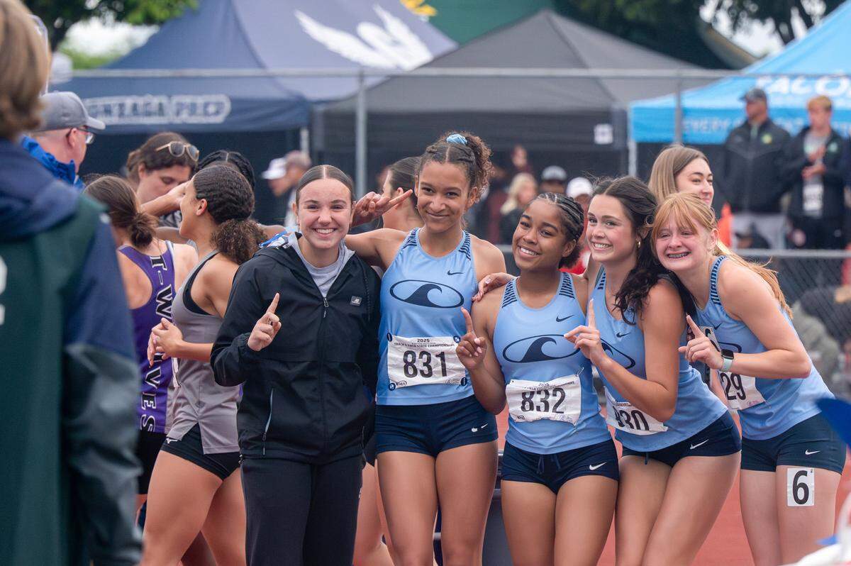 Gig Harbor’s 4x100-meter relay team poses for a celebratory photo after winning 3A girls final with a time of 47.96 seconds on Saturday, May 31, 2025, during the 2025 WIAA Track & Field Championships at Mount Tahoma High School in Tacoma, Wash.