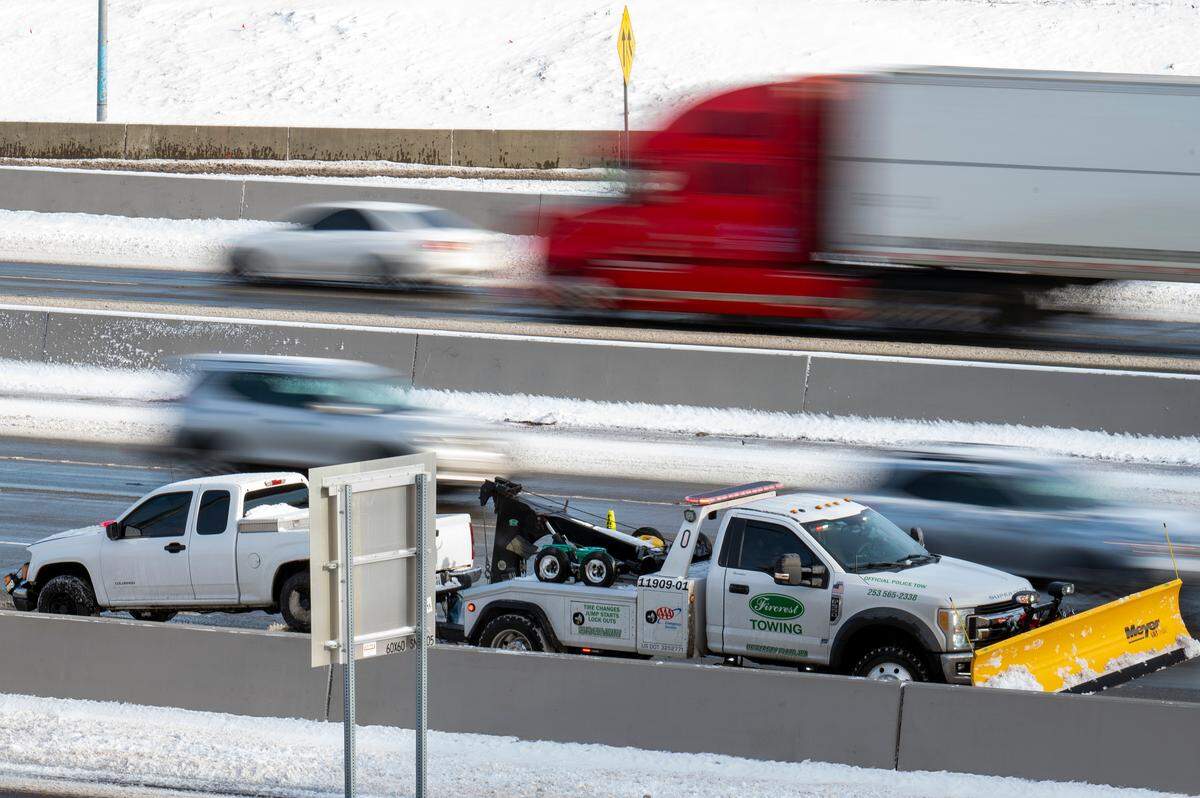 A truck that was involved in an accident along southbound Interstate 5 is prepared to be towed away south of the 38th Street overpass on Monday afternoon in Tacoma.