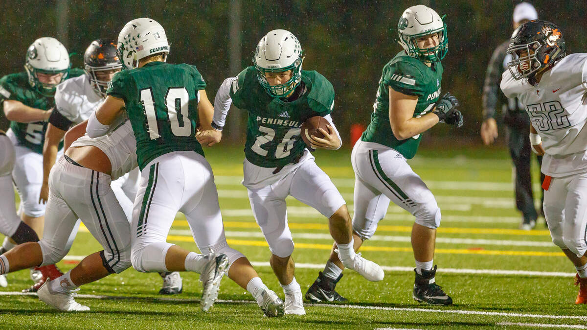 Peninsula’s Shawn Leonard carries the ball against Central Kitsap on Friday, Oct. 5.