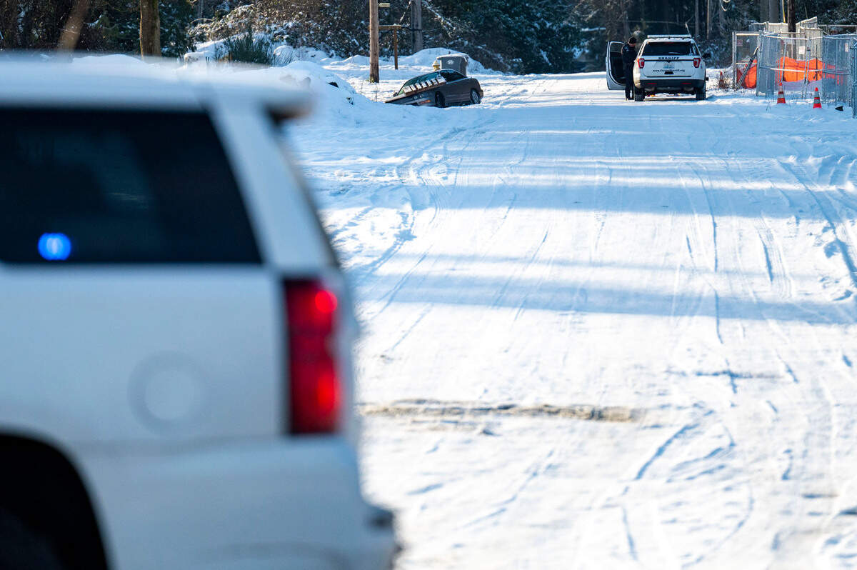 Law enforcement vehicles close off 84th Avenue in Puyallup after apprehending a man who was involved in a brief standoff with the Pierce County Sheriff’s Department on Friday morning in Puyallup.