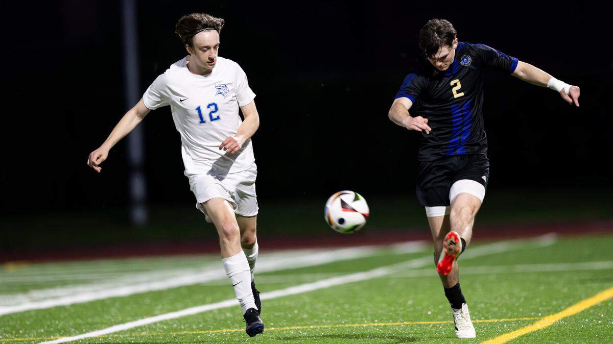 Sumner defender Jacob Morgan (2) moves the ball down the pitch against Curtis forward Patrick Myers (12) during the 4A District Boys Soccer Championship match at Auburn Memorial Stadium, on Thursday, May 9, 2024, in Auburn, Wash.