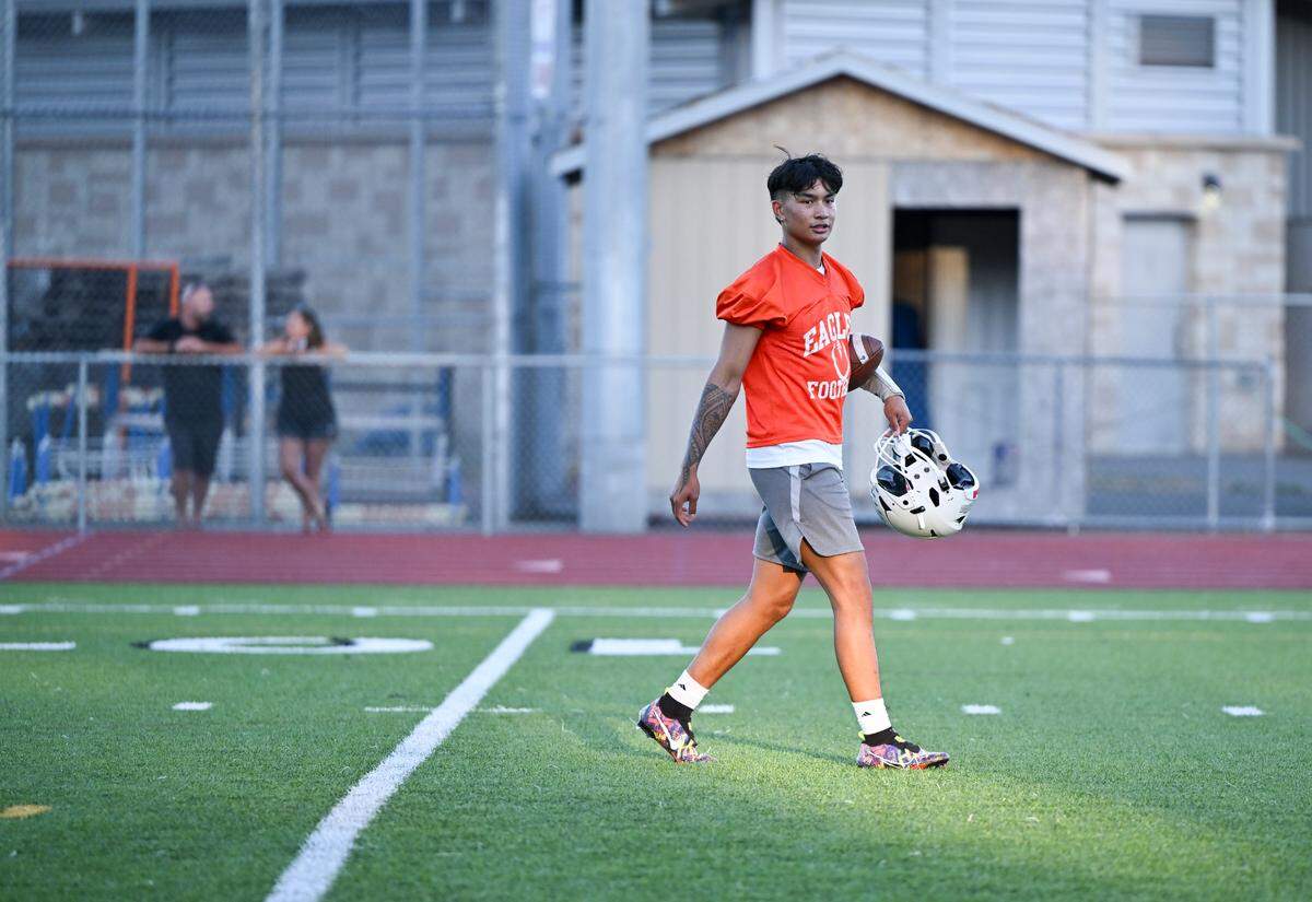 Graham-Kapowsin quarterback Daveon Superales walks off the field during a football practice at Graham-Kapowsin High School, Wednesday, Aug. 16, 2023, in Graham, Wash.