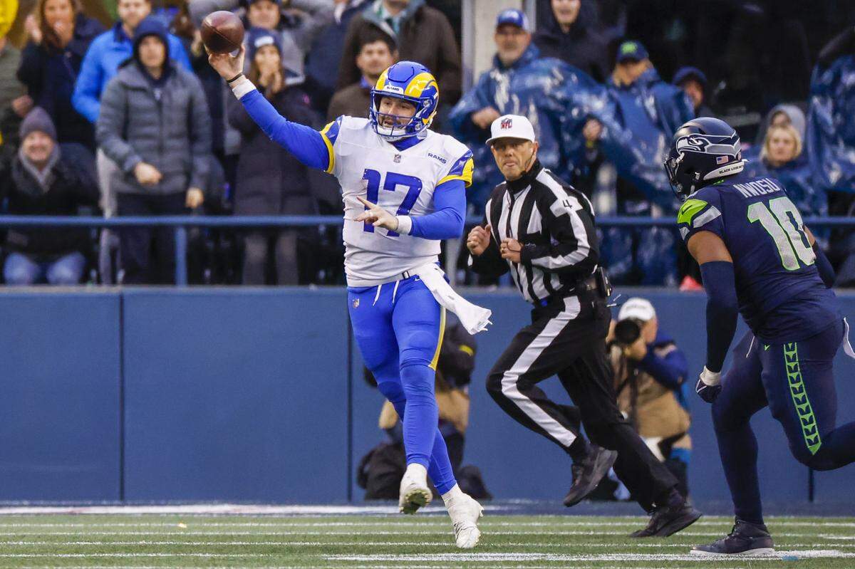 Jan 8, 2023; Seattle, Washington, USA; Los Angeles Rams quarterback Baker Mayfield (17) passes against the Seattle Seahawks during the fourth quarter at Lumen Field. Mandatory Credit: Joe Nicholson-USA TODAY Sports