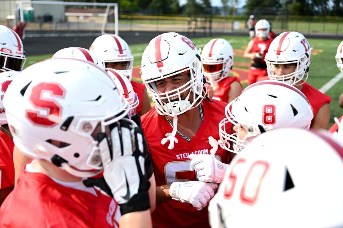 Steilacoom players huddle during a practice at Steilacoom High School, Wednesday, Aug. 23, 2023, in Steilacoom, Wash.