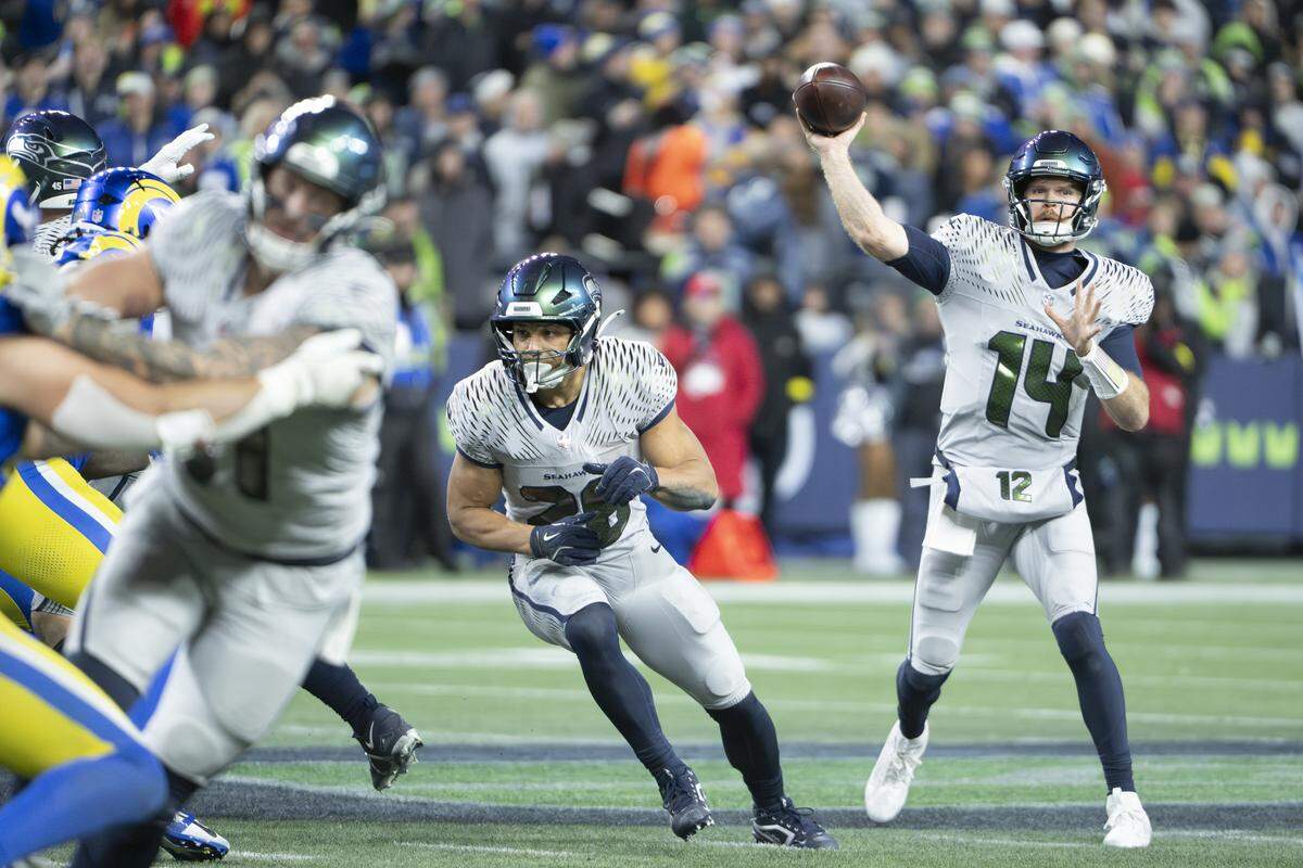 Seattle Seahawks quarterback Sam Darnold (14) prepares to pass the ball during the second half of a game against the Los Angeles Rams at Lumen Field, on Thursday, Dec. 18, 2025, in Seattle.