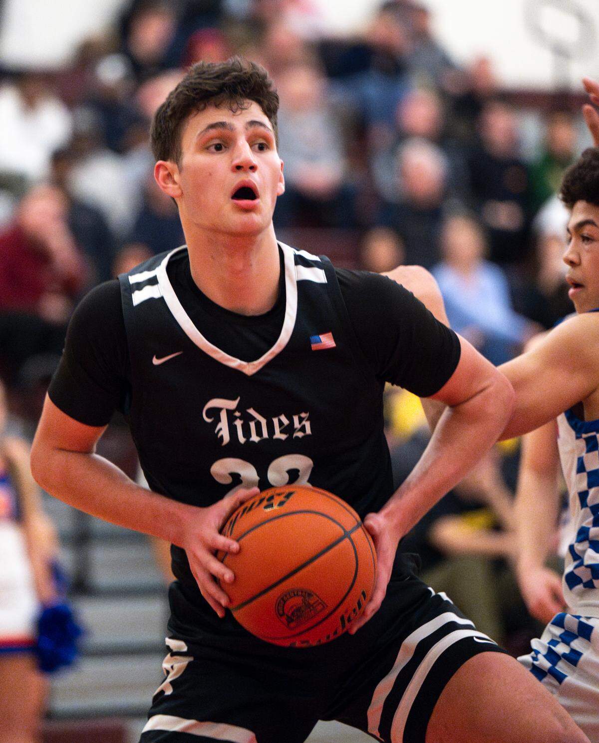 Gig Harbor’s Michael Masini (23) secures a rebound against Auburn Mountainview during the first half of the 3A District 3/4 tournament boys semifinal on Tuesday, Feb. 18, 2025, in Tacoma. 