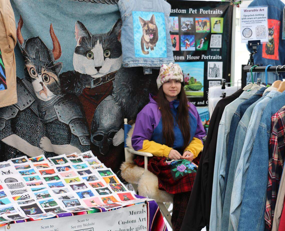A vendor offers pet portraits at Northwest Metaphysical Market in Tacoma.