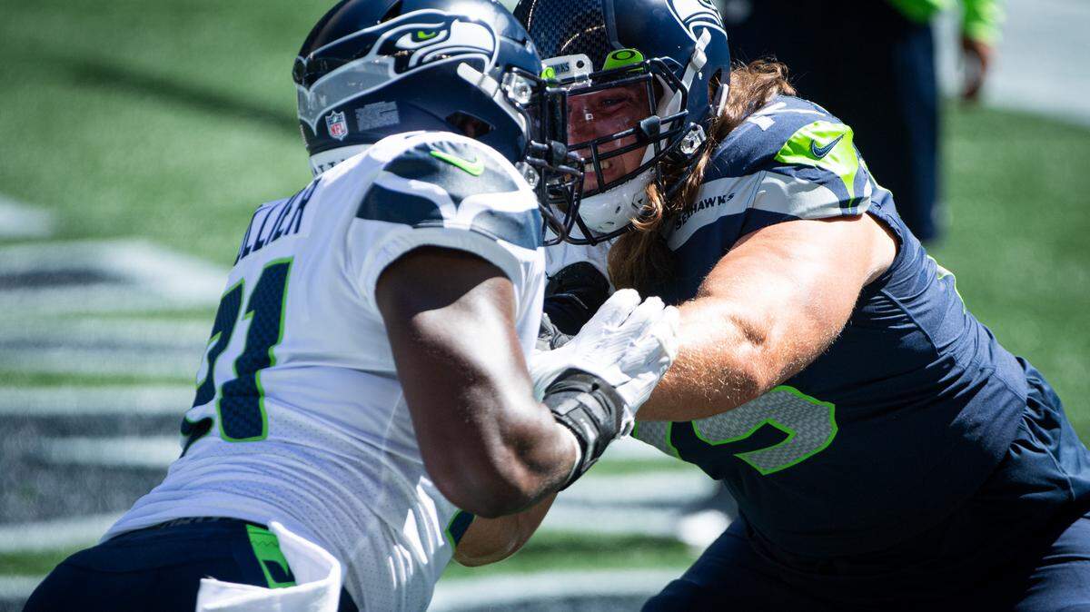L.J. Collier and Chad Wheeler take part in drills before the game. The Seattle Seahawks played a mock game at CenturyLink Field in Seattle, Wash., on Wednesday, Aug. 26, 2020.