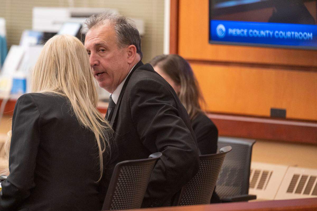Pierce County Sheriff Ed Troyer talks to his defense attorney, Anne Bremner, prior to closing arguments on Tuesday, Dec. 13, 2022, in Pierce County District Court in Tacoma.