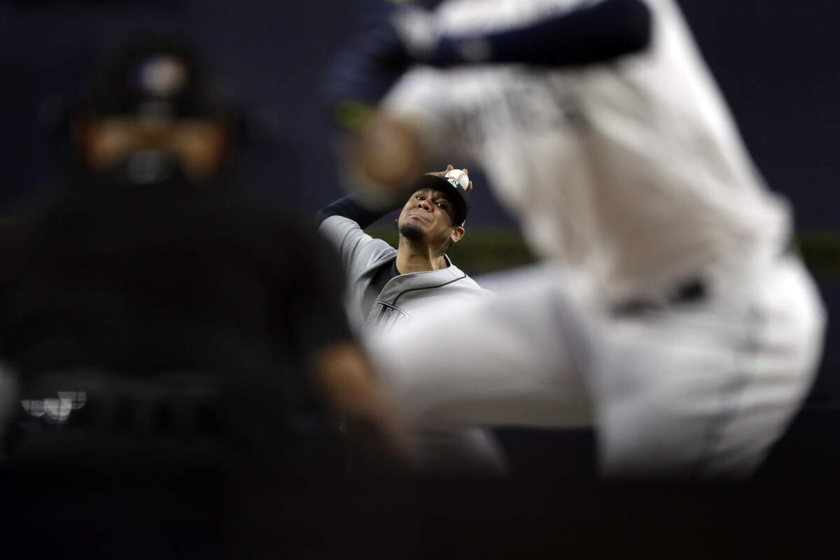 Seattle Mariners starting pitcher Felix Hernandez works against a San Diego Padres batter during the first inning of a baseball game, Tuesday, Aug. 28, 2018, in San Diego. (AP Photo/Gregory Bull)