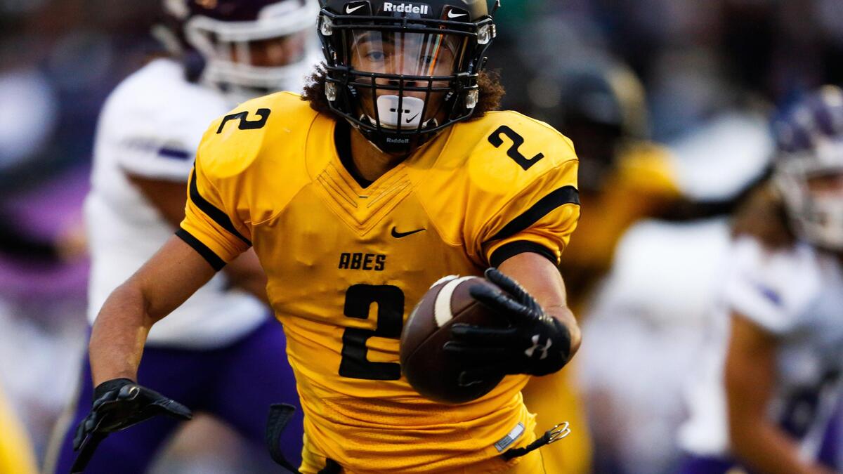 Lincoln’s Jeddiah Hayes (2) rushes for a touchdown in the first quarter. Lincoln played Lake Stevens in a football game at the Lincoln Bowl in Tacoma, Wash., on Friday, Sept. 13, 2019. 
