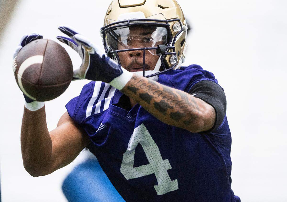 University of Washington Huskies wide receiver Lonyatta Alexander Jr., 4, catches the ball during a drill at the first day of Fall practice at Husky Stadium on Thursday, Aug. 4, 2022 in Seattle, Wash.