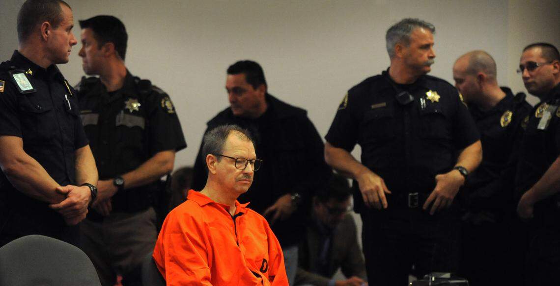 Gary Ridgway is surrounded by heavy security before getting sentence in Judge Mary Roberts courtroom at the Kent Regional Justice Center on Friday, February 18, 2011 for the murder of Rebecca "Becky" Marrero. (Lui Kit Wong/The News Tribune)