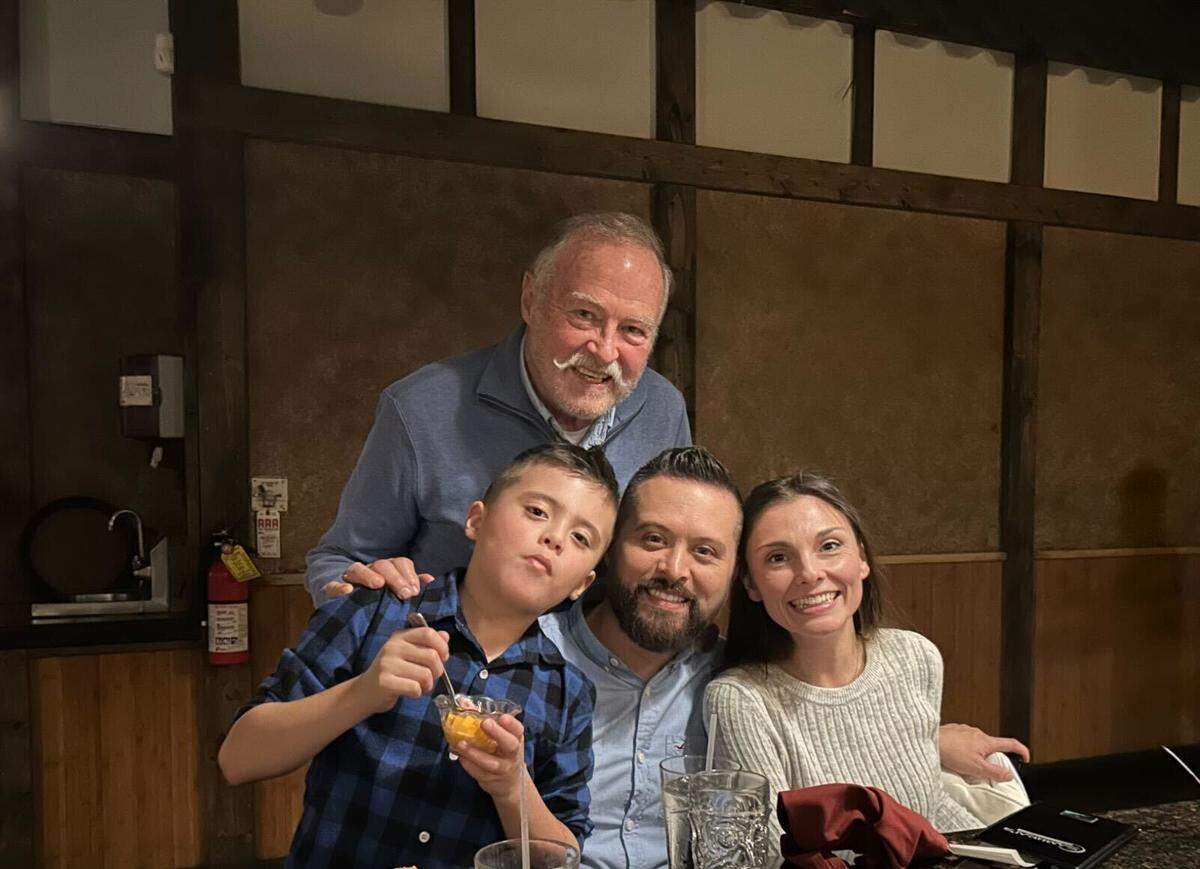 Justin Starbuck with his father, wife and son. His father died about two weeks ago following a stroke.