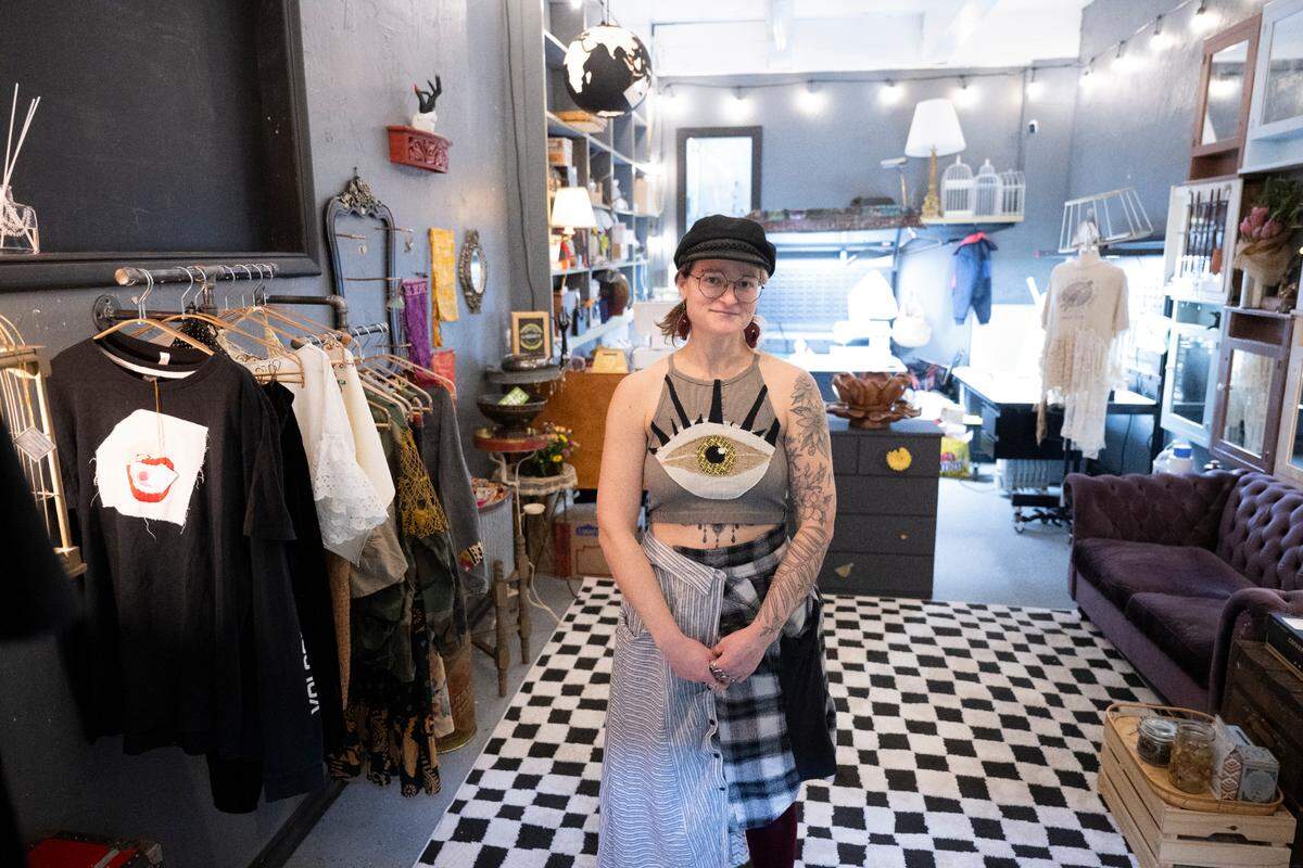 Owner Sequoia Sol poses for a portrait in her new shop, Art Eye Choke, inside of Sanford & Sons Antiques, on Thursday, Feb. 6, 2025, in Tacoma.