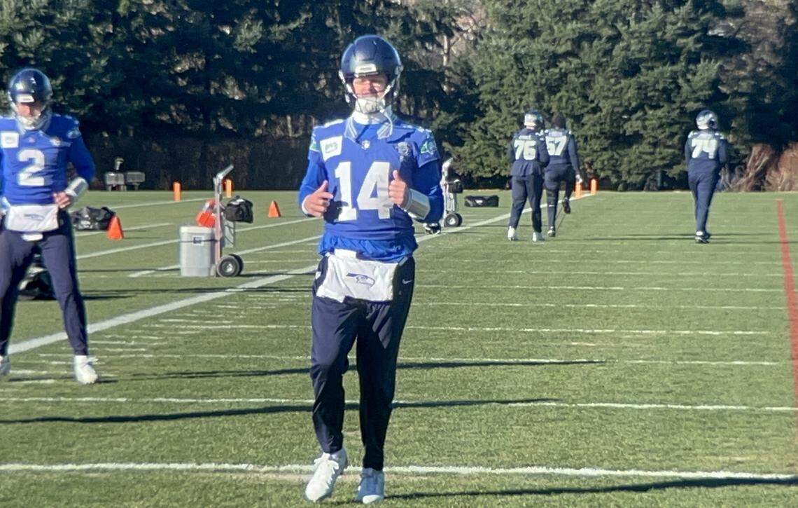 Quarterback Sam Darnold (14) warms up before his limited practice Friday, Jan. 23, 2026, at the Virginia Mason Athletic Center in Renton two days before he and his Seahawks host the Los Angeles Rams in the NFC championship game at Lumen Field in Seattle.