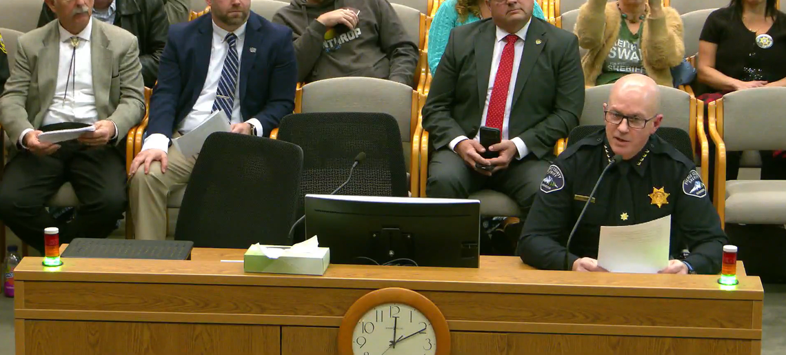 Pierce County Sheriff Keith Swank (lower right) speaks before the state Senate Committee on Law & Justice in Olympia on Thursday, Jan. 15, 2025, in opposition to a bill that would create stricter eligibility requirements for police chiefs, marshals and sheriffs and remove elected sheriffs from office if the Criminal Justice Training Commission revokes their certification as a law enforcement officer.
