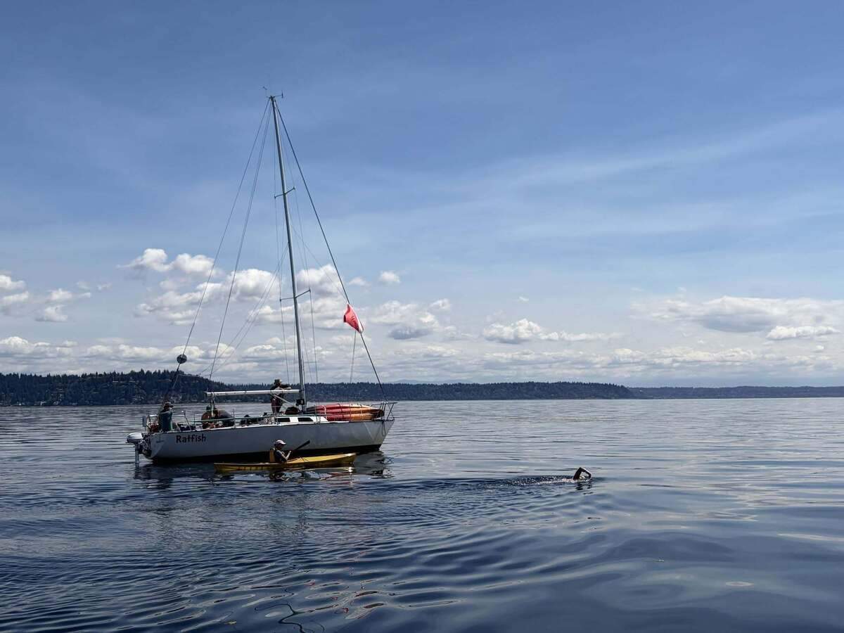 3. Mary Singer Courtesy Northwest Open Water Swimming Association.jpg Mary Singer swimming by supporters during her Vashon Island circumnavigation on Wednesday, August 12.