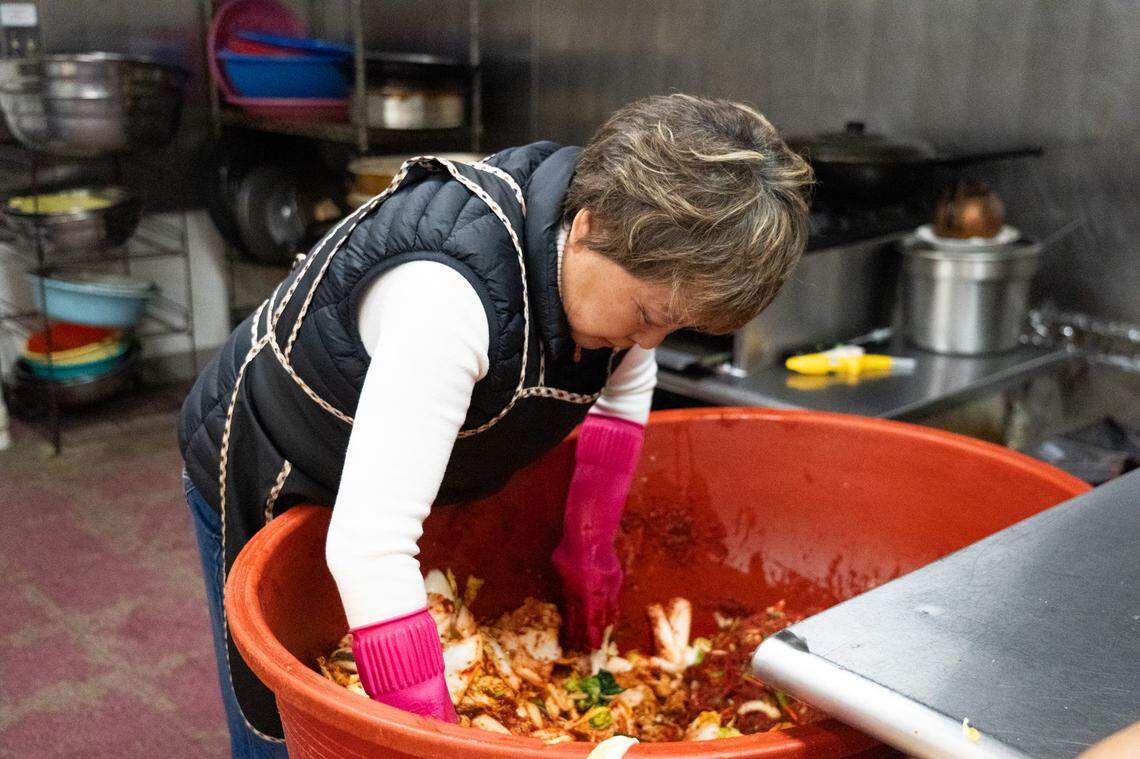 Store owner Hyo Sook Cho makes another batch of kimchi.