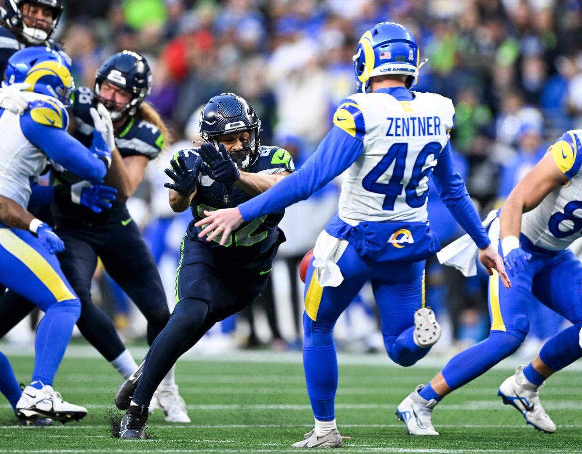 Seattle Seahawks wide receiver Cody White (82) blocks a punt from Los Angeles Rams punter Ty Zentner during the fourth quarter of the game at Lumen Field, on Sunday, Nov. 3, 2024 in Seattle, Wash.