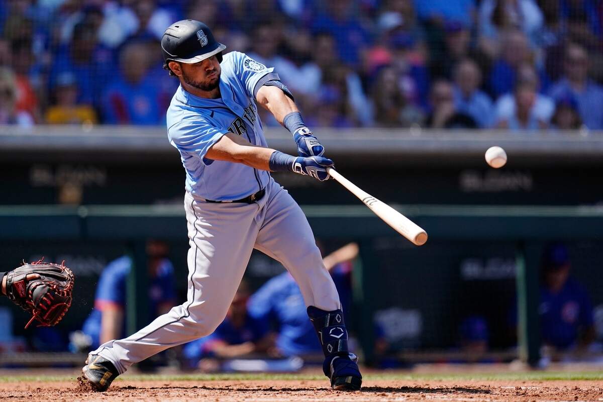 Seattle Mariners’ Eugenio Suarez fouls off a pitch against the Chicago Cubs during the third inning of a spring training baseball game Wednesday, March 30, 2022, in Mesa, Ariz. (AP Photo/Ross D. Franklin)