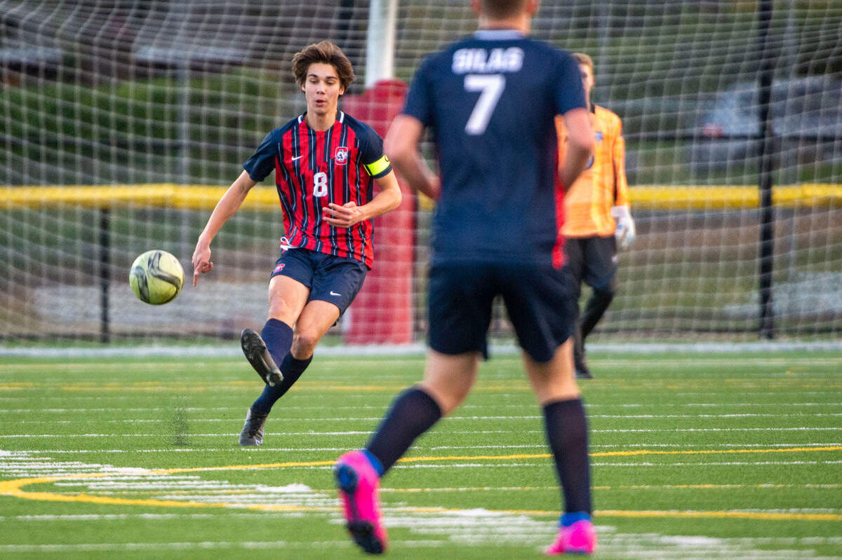 Silas defender Silas Brunner passes the ball upfield during the first half of a Pierce County League game against Lakes on Thursday, March 31, 2022, at Silas High School in Tacoma, Wash.
