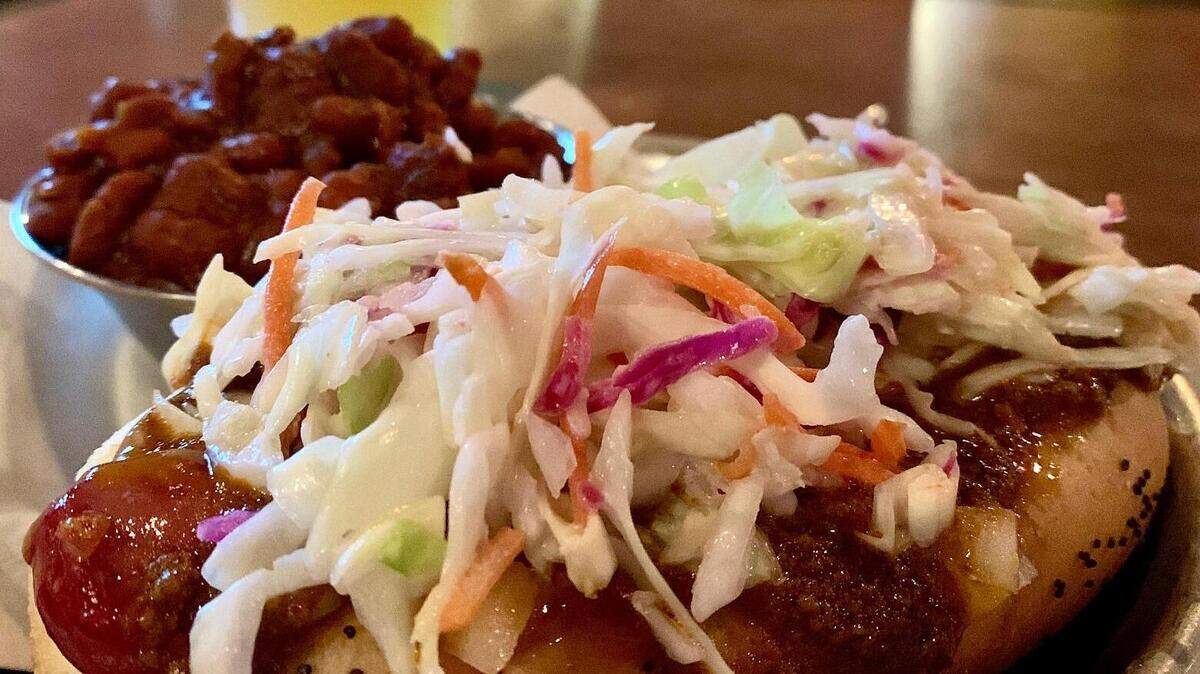 The Destiny City Dog at The Red Hot in Tacoma adds coleslaw and chili. The renowned beer bar also makes some mean vegan baked beans.