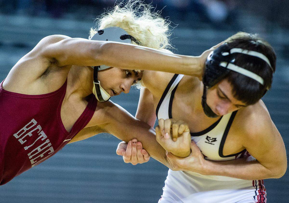 Bethel’s Donnie Krissak wrestles North Central’s Kenndyl Mobley during Mat Classic XXXI at the Tacoma Dome in Tacoma, Wash., on Saturday, Feb. 16, 2019.