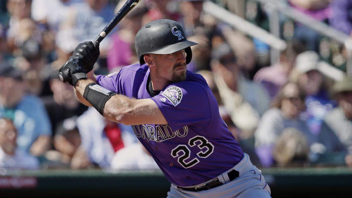 Colorado Rockies’ Tom Murphy bats during a spring training baseball game against the Cleveland Indians Thursday, March 14, 2019, in Goodyear, Ariz. (AP Photo/Sue Ogrocki)