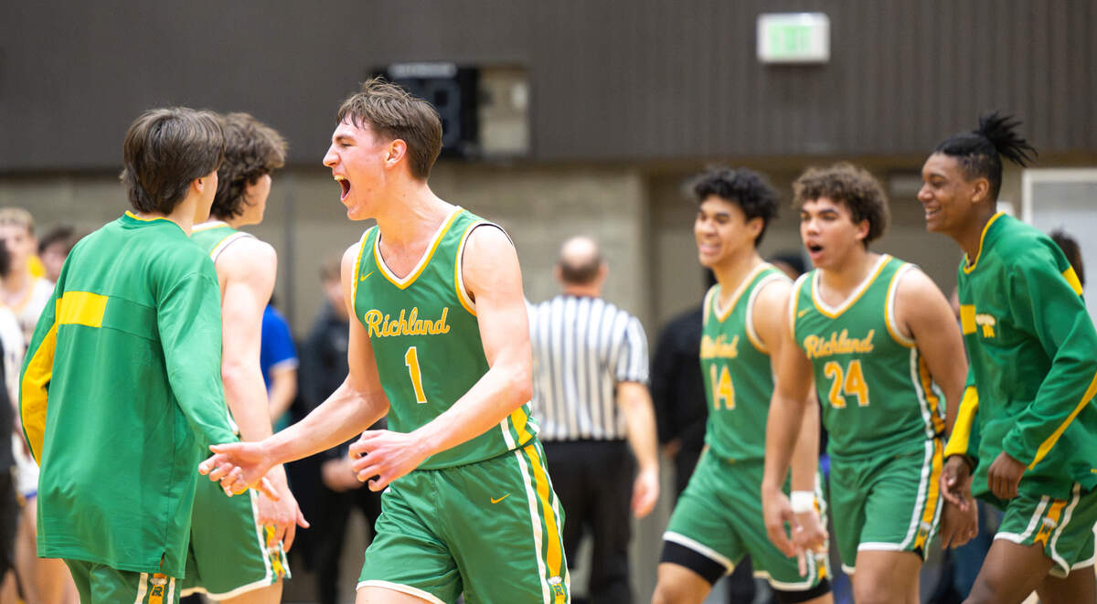 Richland celebrates their 77-59 victory over Tahoma during the 4A state regional boys game at Auburn Senior High School, on Saturday, Feb. 24, 2024 in Auburn, Washington.