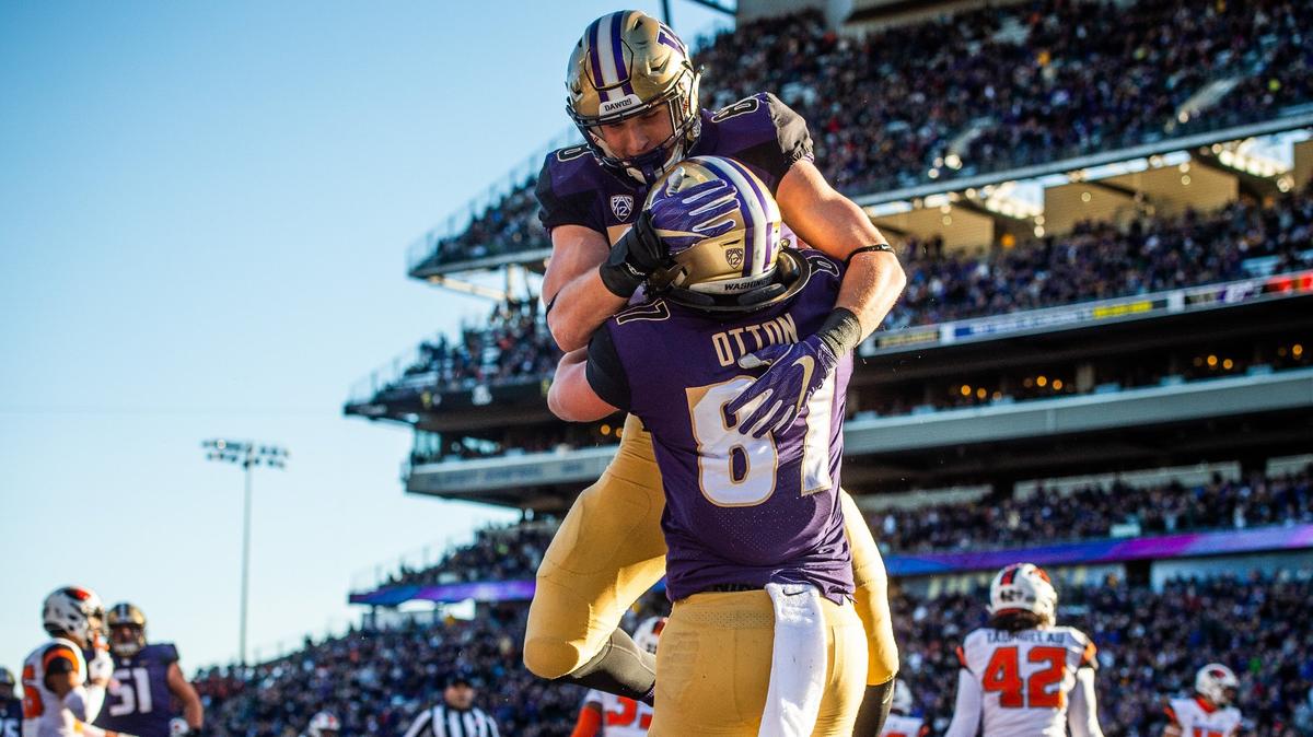 Washington tight end Drew Sample (88) and Washington tight end Cade Otton (87) celebrate Otton’s touchdown catch in the first quarter. The Washington Huskies played the Oregon State Beavers in a NCAA football game at Husky Stadium in Seattle, Wash., on Saturday, Nov. 17, 2018.